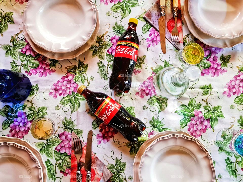 table set for dinner with friends ... inevitable Coca Cola