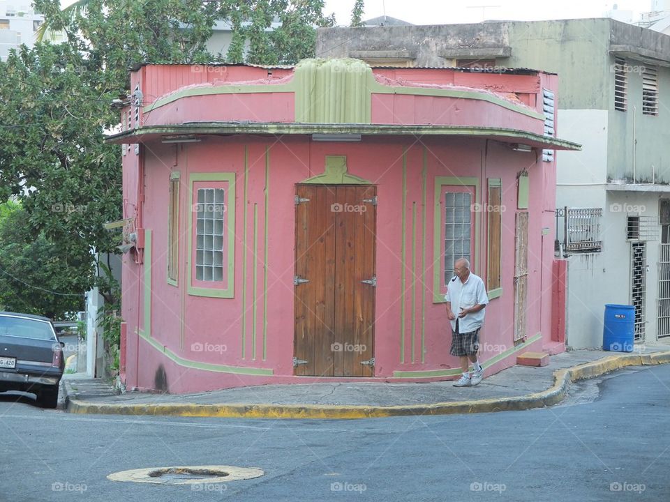 Pink house and a man