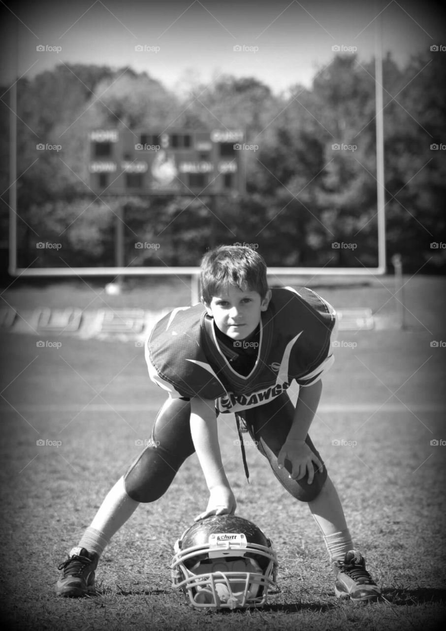 Three Point Stance. Young football player in his three point stance. 