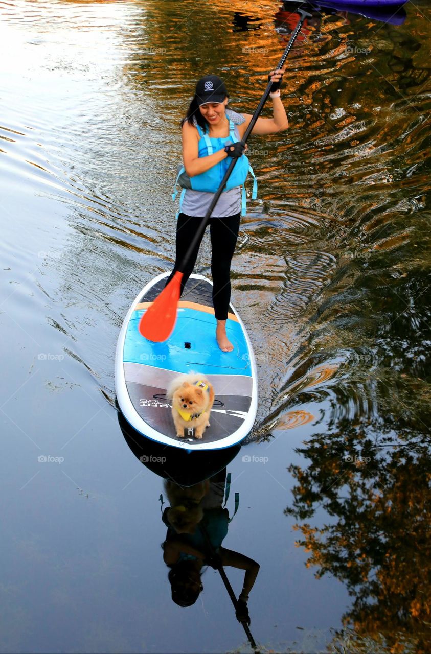 Lady boating with her dog