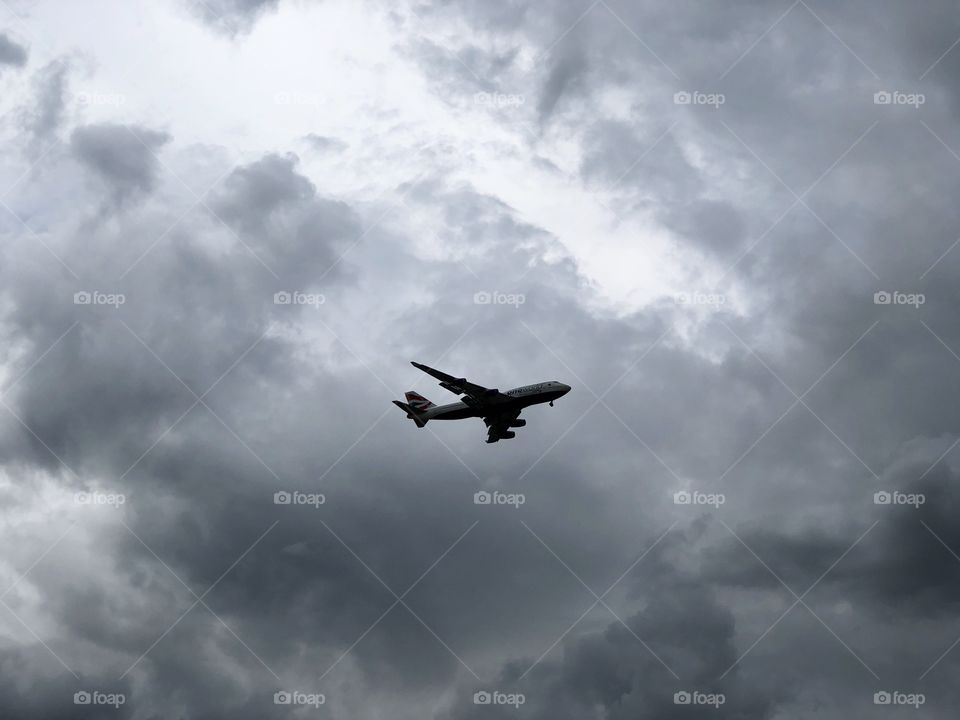 Large 747 airplane on a dark cloudy day