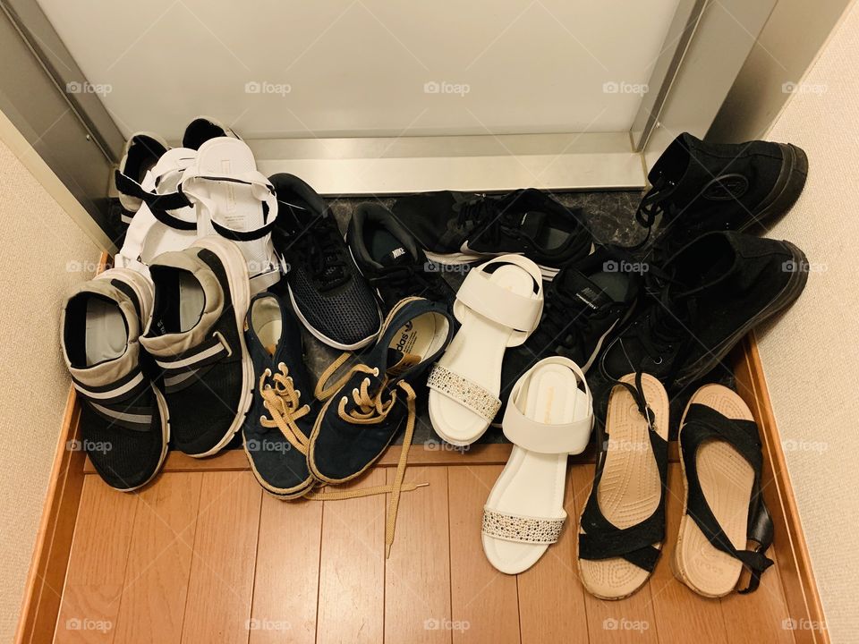 Picture of many shoes on the door means many visitors. 