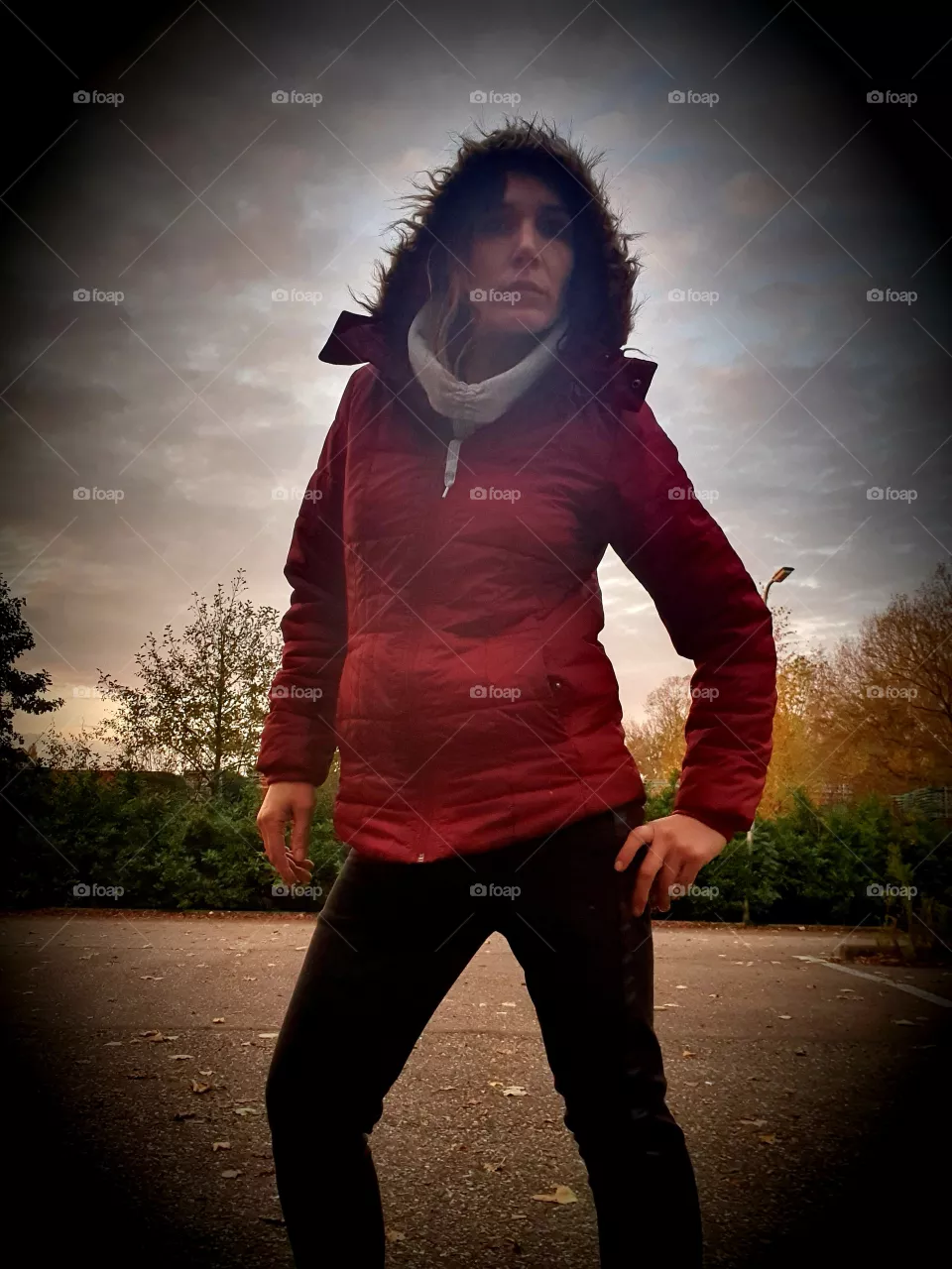 Woman looks into the camera outside.
