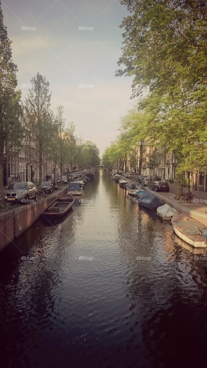 A Picture of the canals in the heart of Amsterdam. Beautiful scenery with a lot of Dutch culture.