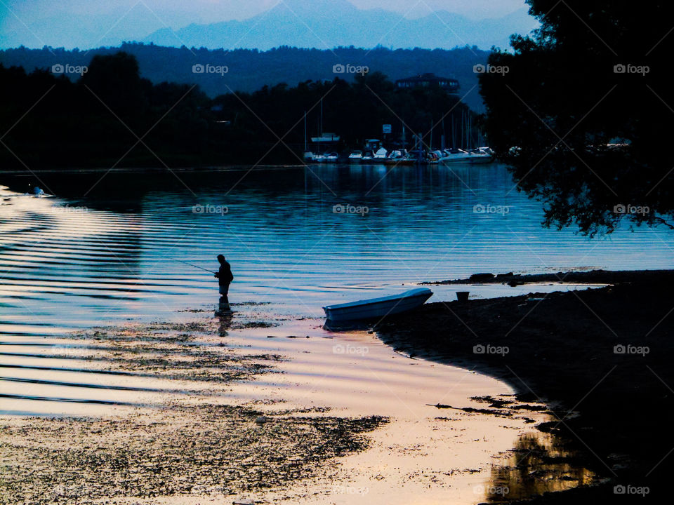 Fisherman in Lake Maggiore in Italy