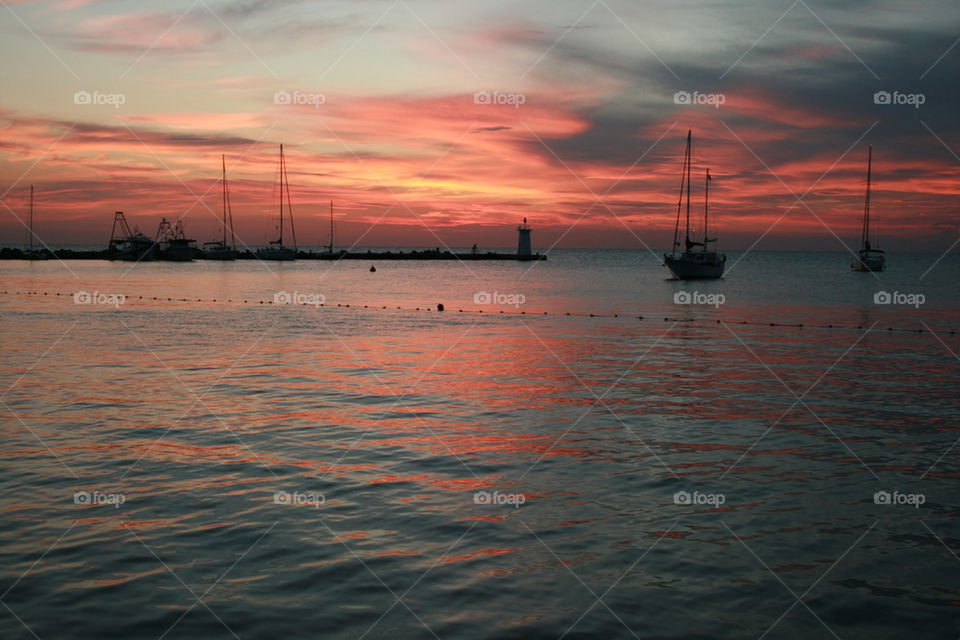 sunset harbor sailboat tunisia by dawidkw