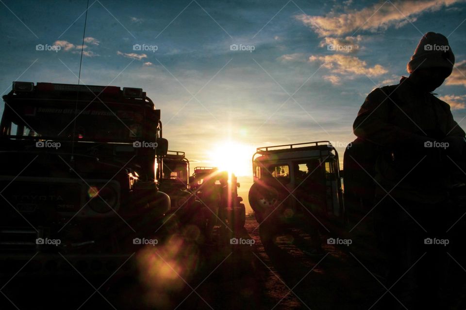 Sunrise that illuminates the car parking area on a hill in the Bromo mountains, East Java.