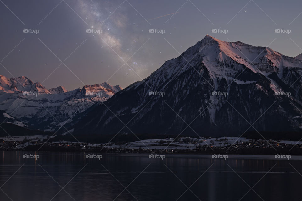 Milky way after sunset with snow mountain.