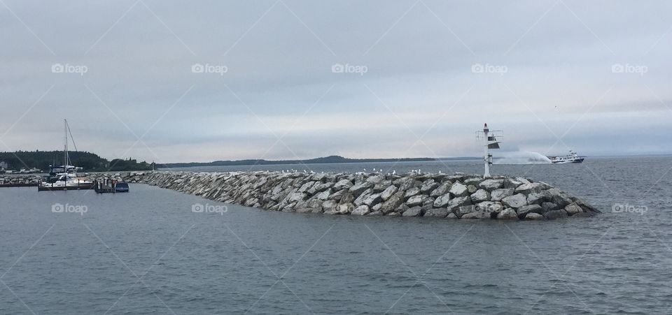 Speed boat rocks sea lake ocean 