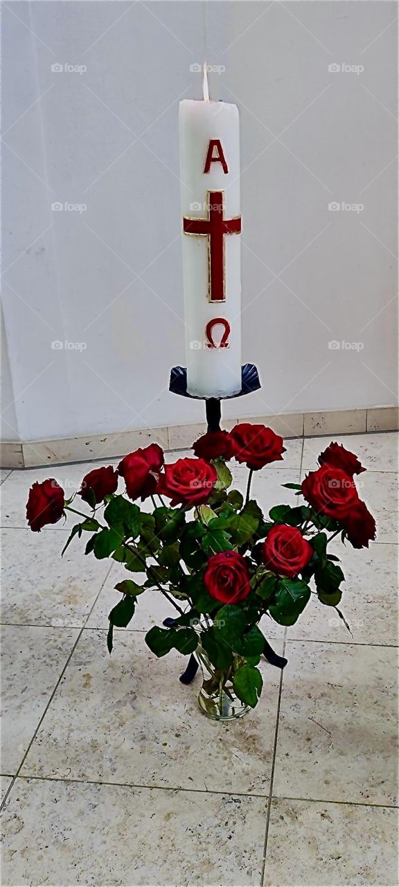 This is a candle to celebrate the resurrection of “Jesus Christ”, our savior, the “Alpha” and the “Omega” on “Easter Sunday” in a church of the small township of “Falkenstein” in the “Bayerischer Wald” or “Bavarian Forest”. 2024. Hypnotic Productions