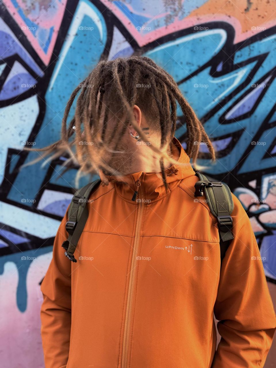 Orange jacket and blue wall🙃