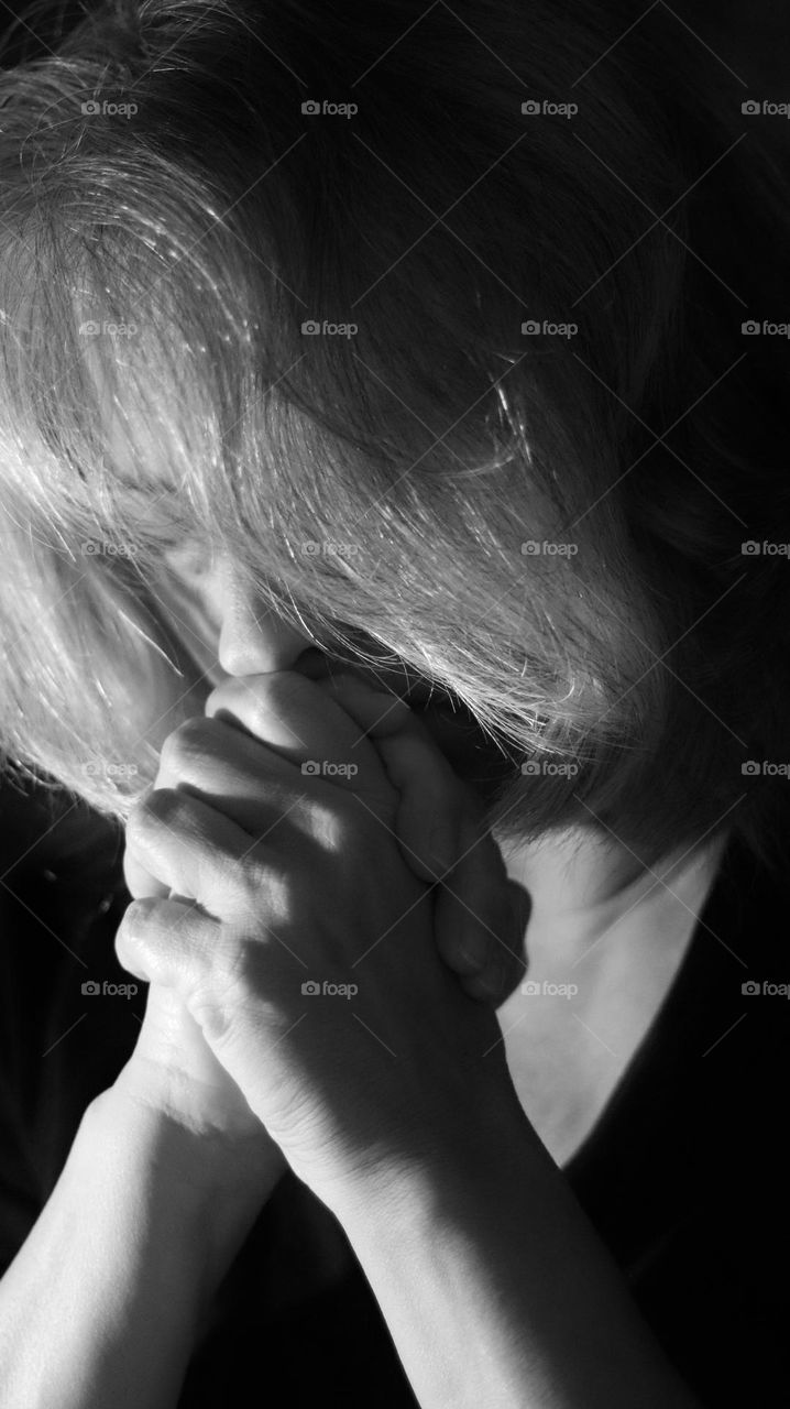 Portrait of woman in earnest prayer