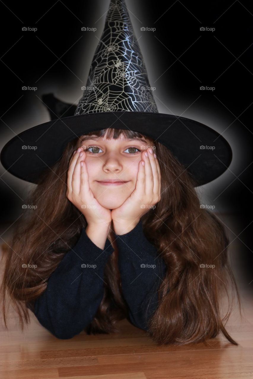 A girl in costume of witch 