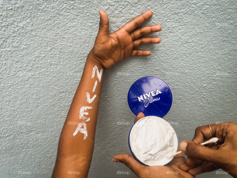 Hands with Nivea creme