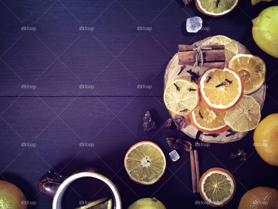 High angle view of lemon slice and cinnamon