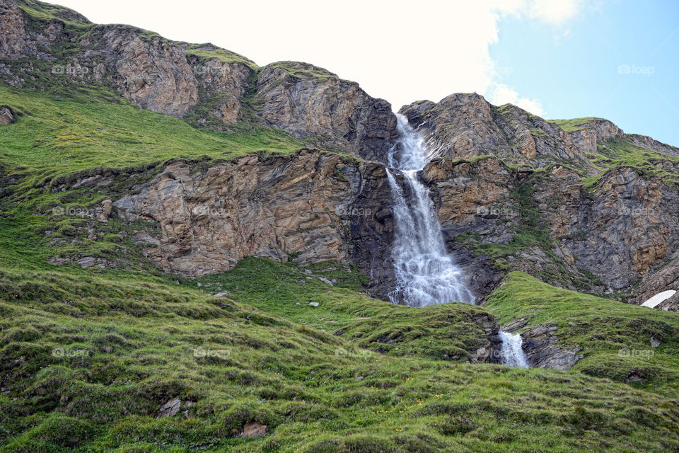 Waterfall at european alps grossglockner mountain range. austria.