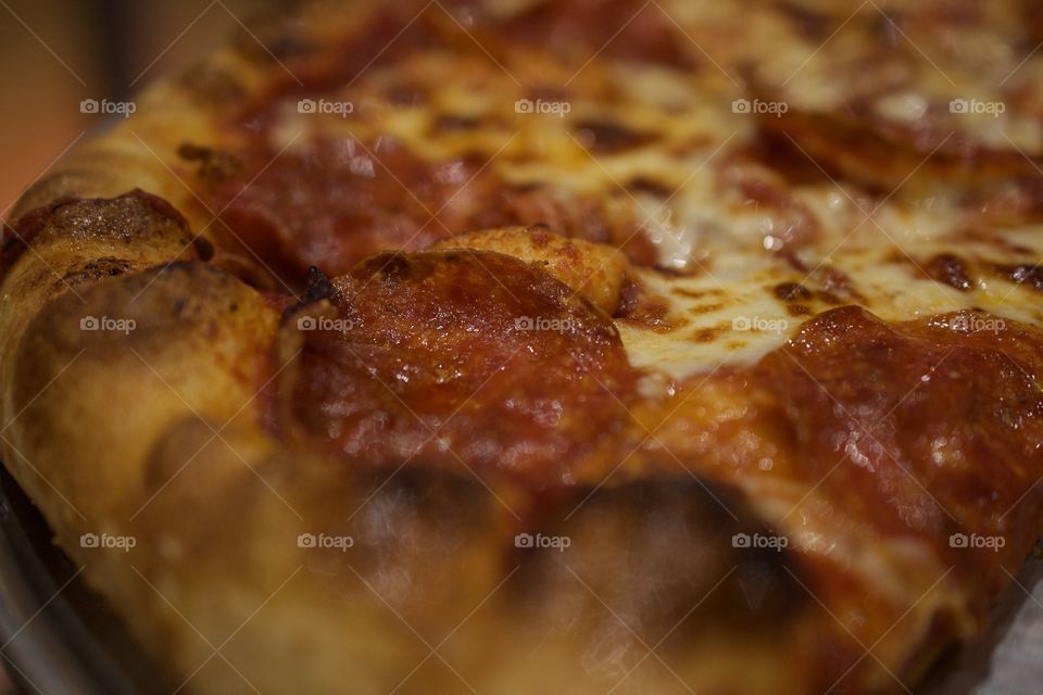Macro shot of pepperoni pizza