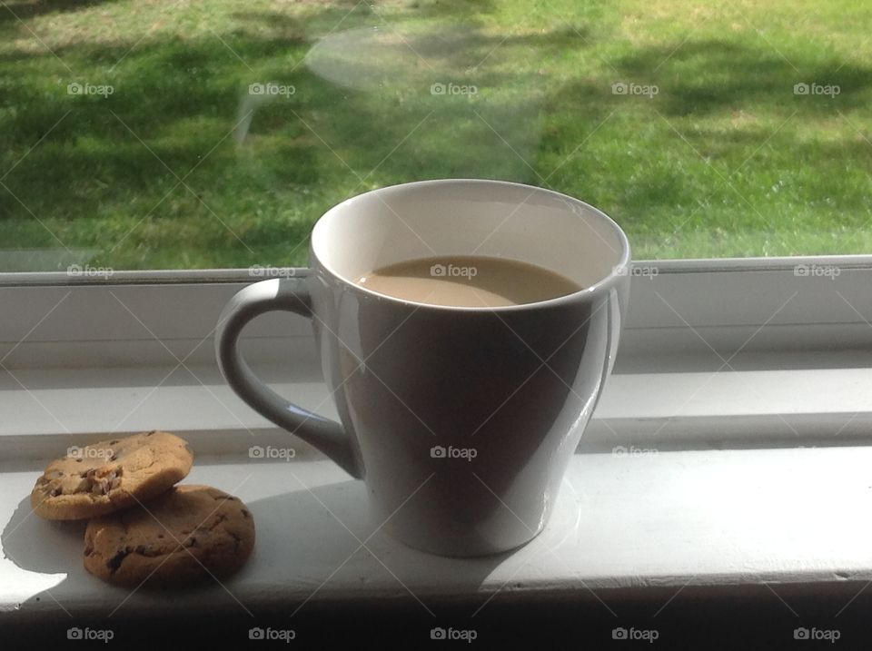 Enjoying a cup of coffee outdoors on a beautiful spring day.