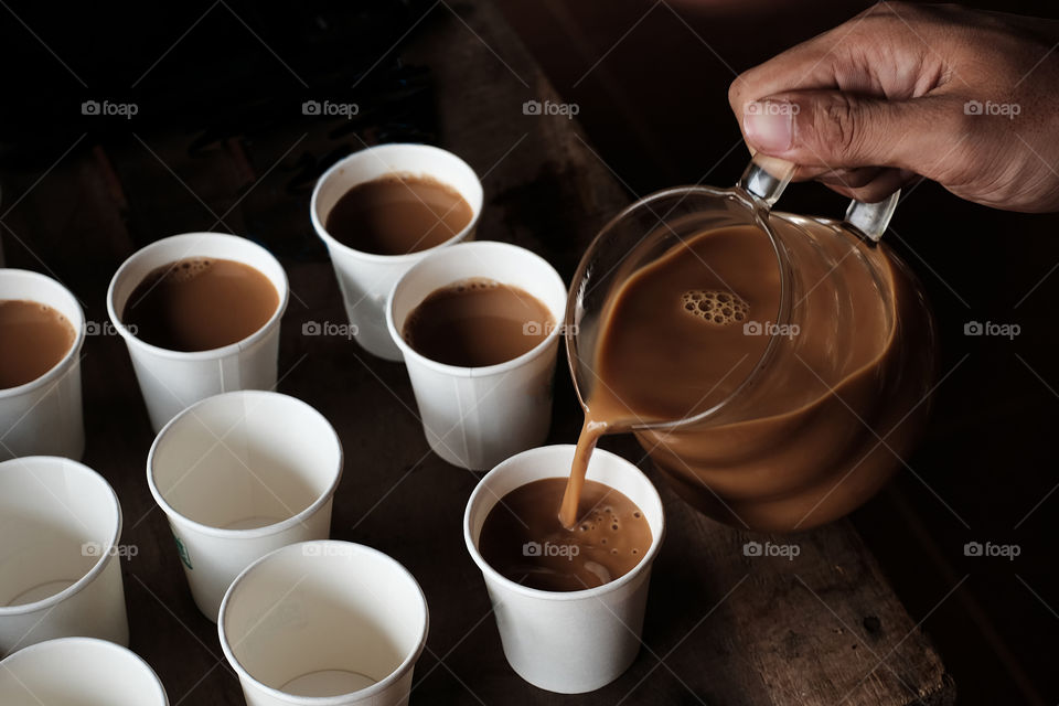 Pouring coffee in to the cup