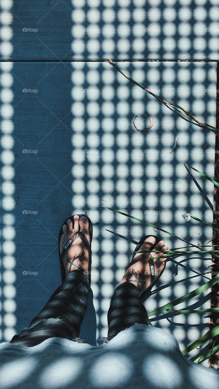 Feet with cool and interesting shadows. 