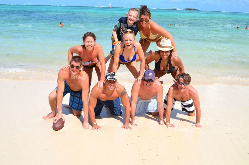 Group of couple enjoying at beach