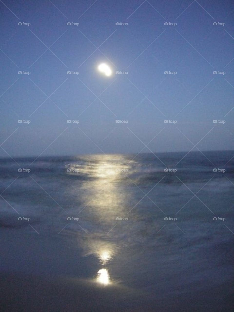 Moonlight beach reflections