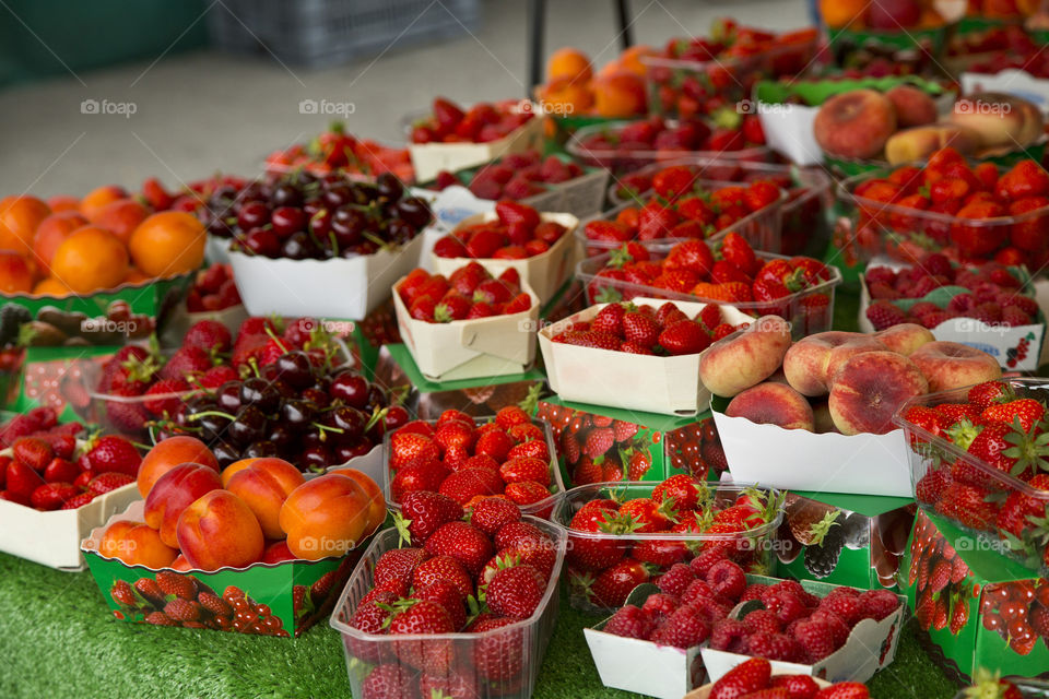 Summer market red fruits display in France