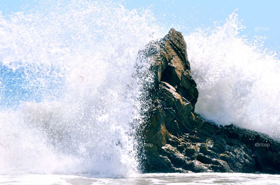 Waves crashing on the rock