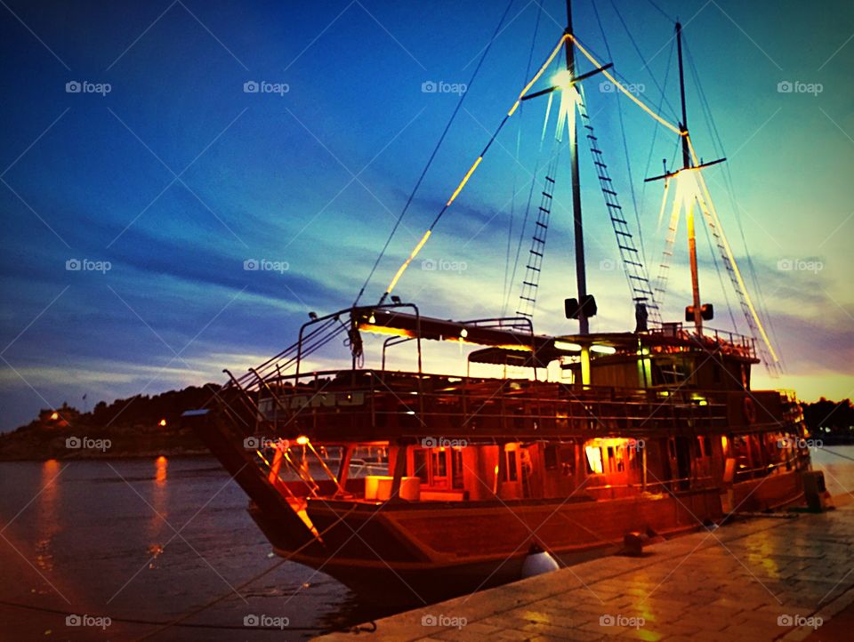 Illuminated ship in harbour