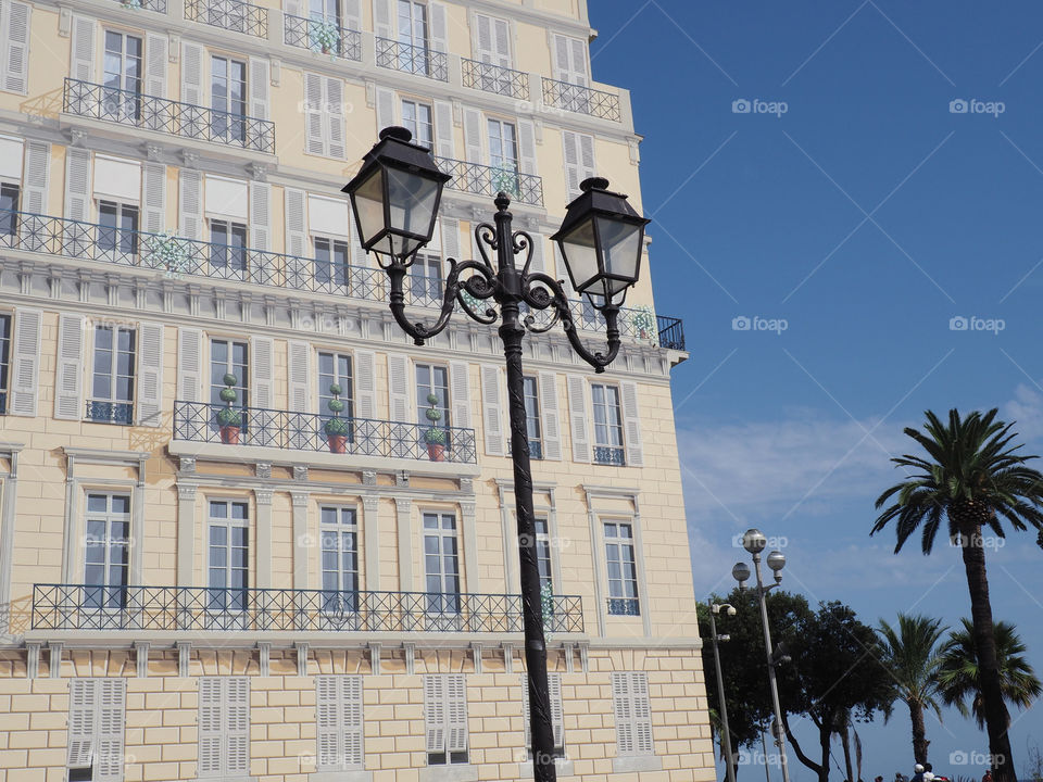 Facade of building with trompe l’œil at the edge of the old town on the Promenade des Anglais in Nice, France.