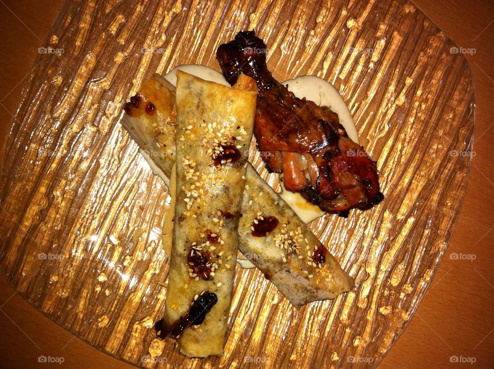 Chicken with dates and  cigars stuffed with meat raisins and tahini sauce