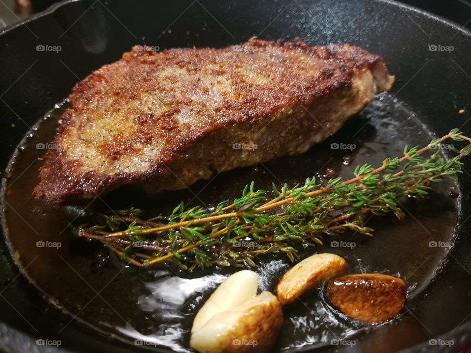Steak, thyme, garlic, salt, pepper, olive oil