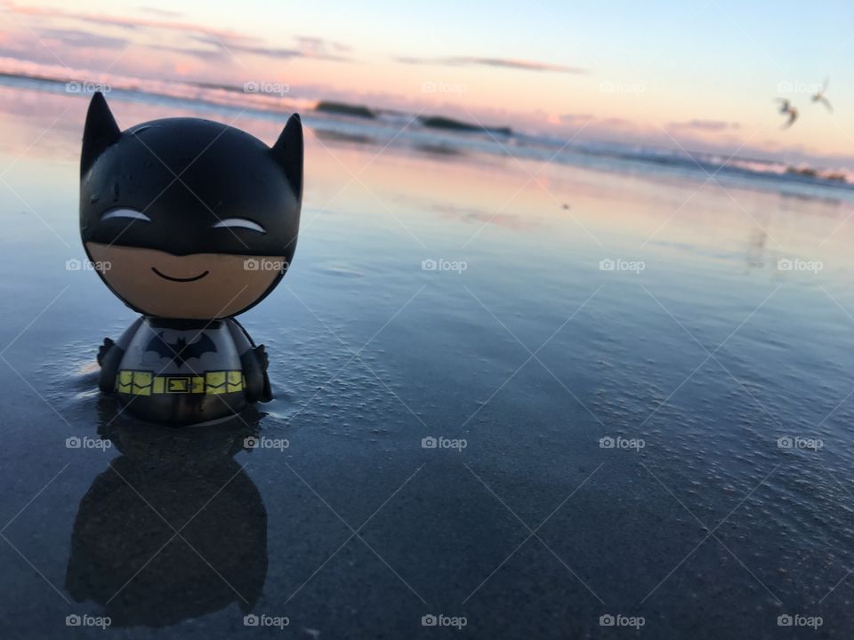 Little batman on the beach. 