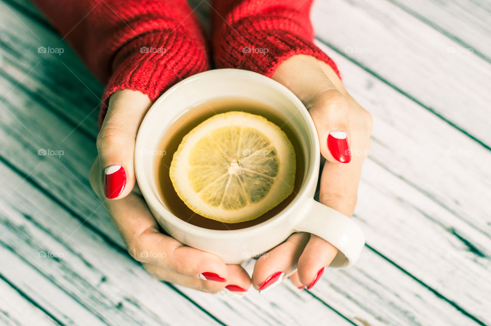 woman hand with cup of tea