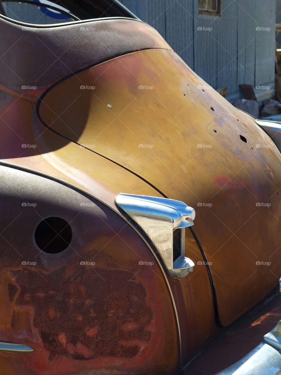 Abandoned rusty luxury sedan car from 1940 decade. Desert isolation