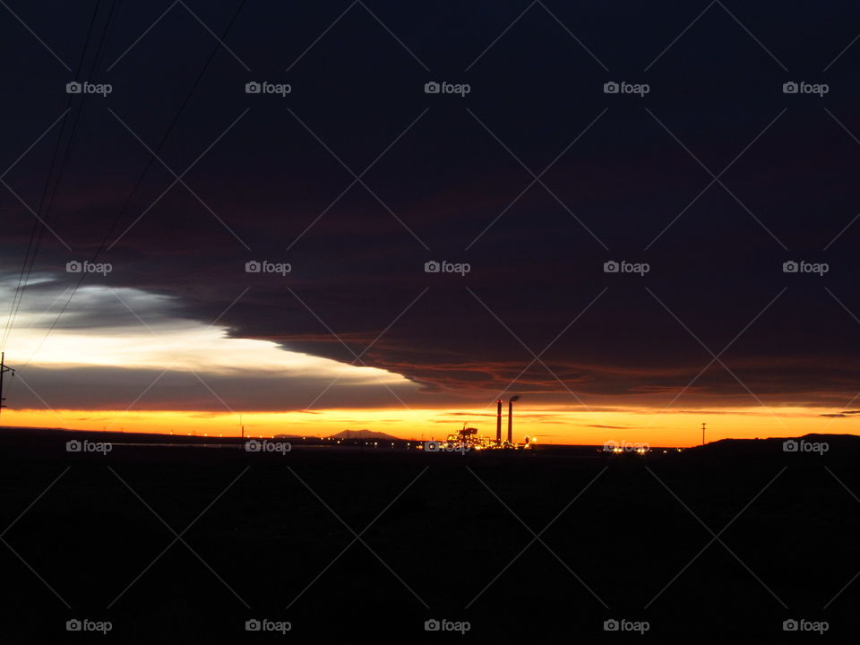 arizona sunset. chola coal plant with flagstaff 80 miles away