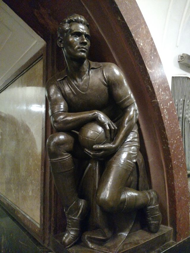 football player. one of many statues in Moscow subway