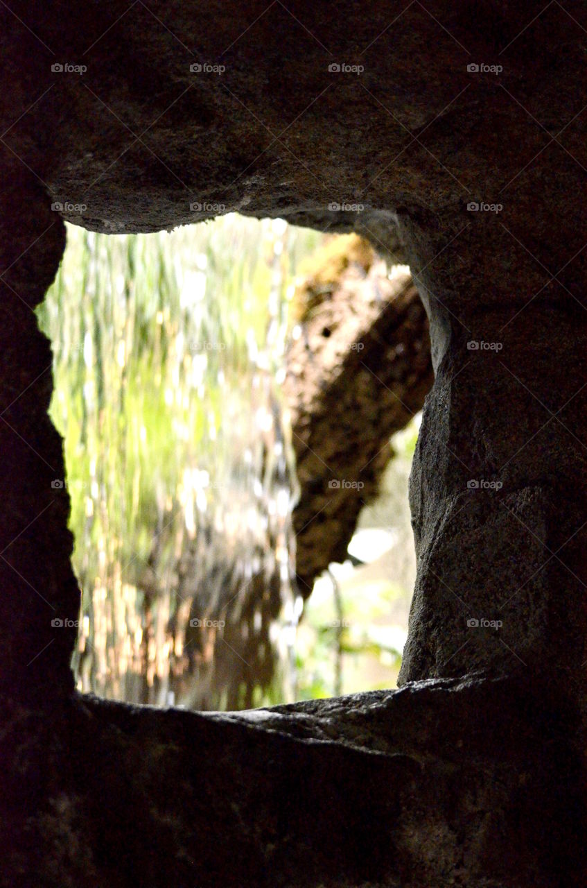 Water Fall through a hole in the rock