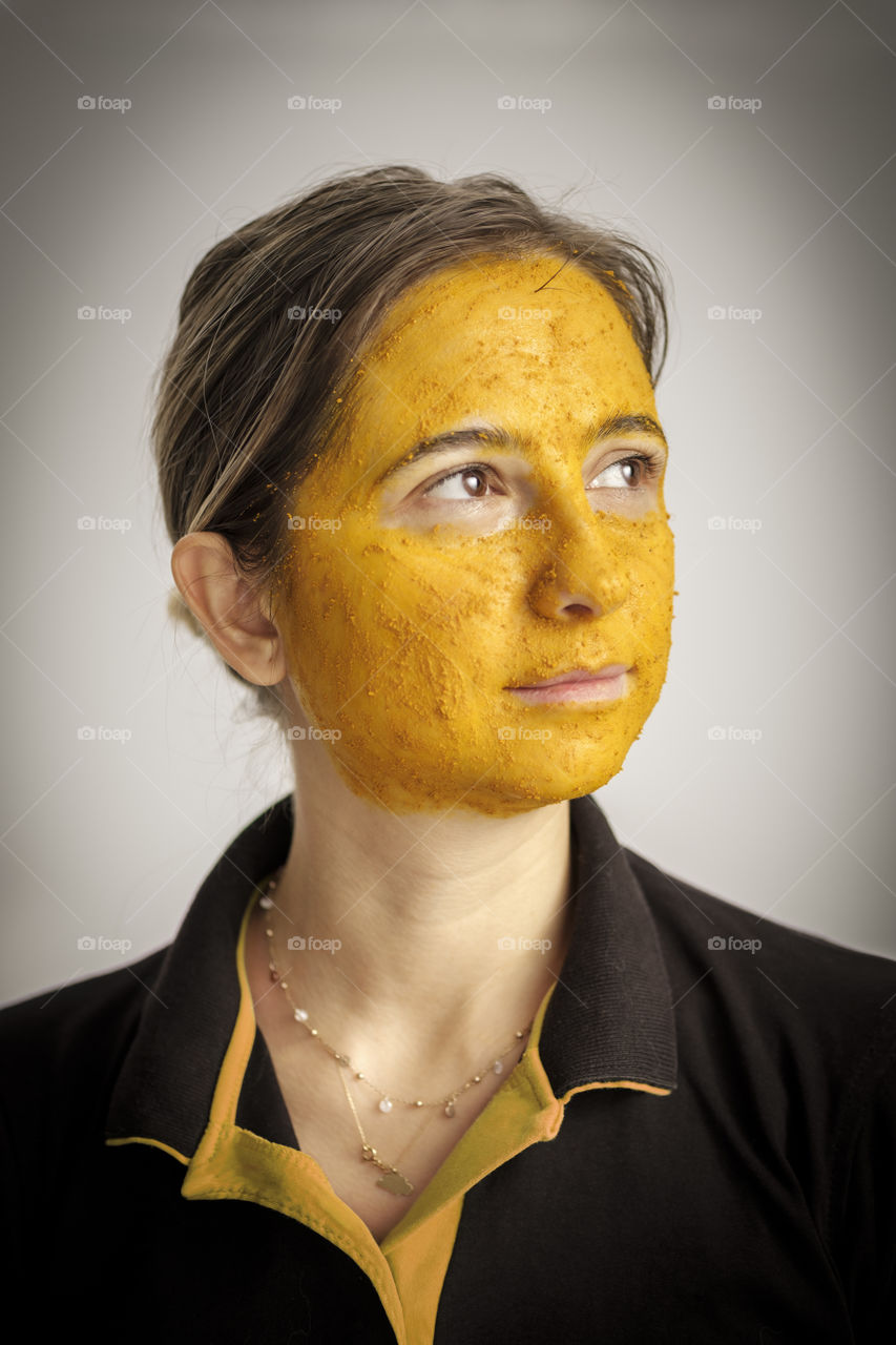 Woman with yellow mask