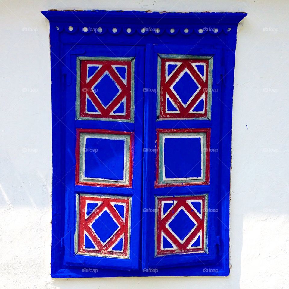 Blue window shutters