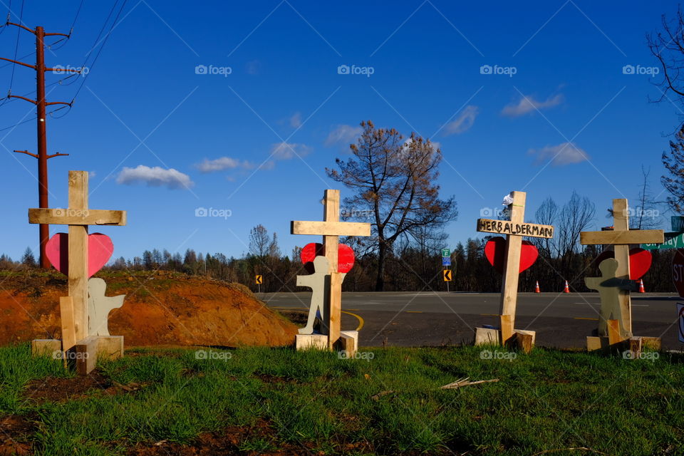 Crosses line the highway into Paradise, CA