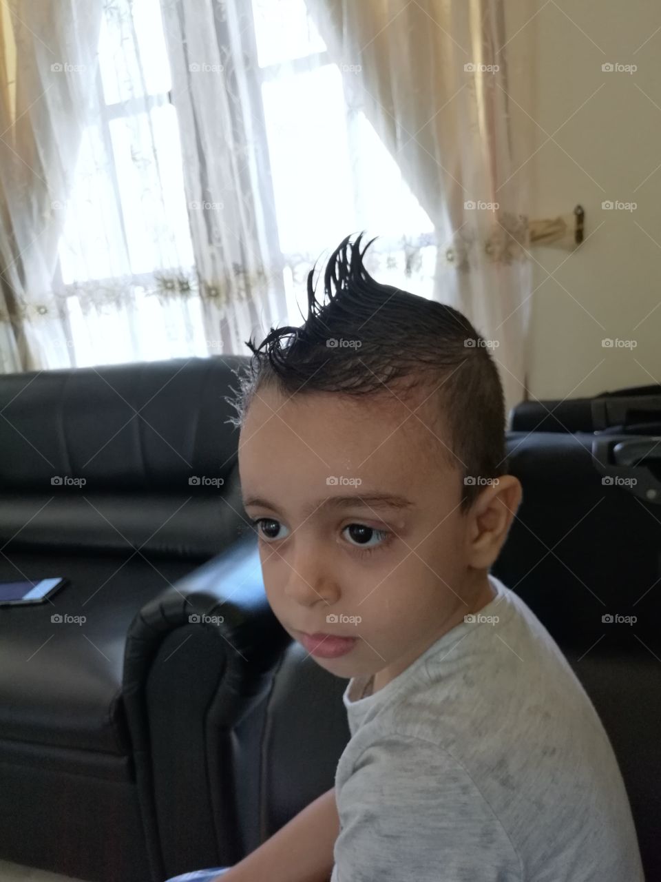 my son is happy with his new hair cut