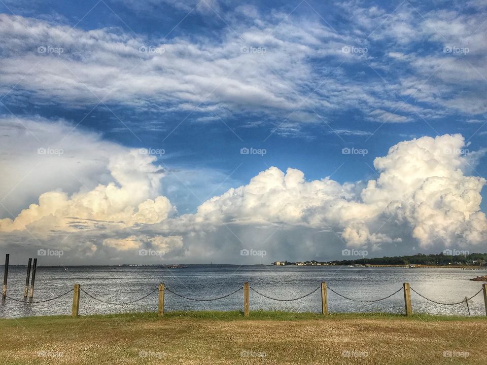 Billowing white clouds rolling in from the ocean