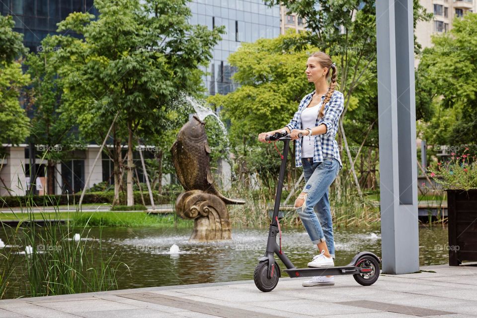 Girl riding on scooter 