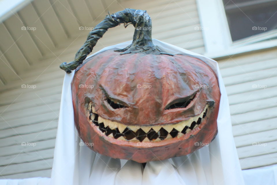 creepy pumpkin with sharp teeth