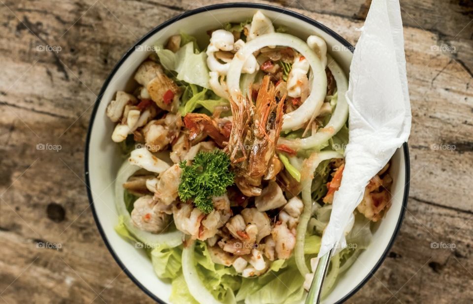 Fresh salad with seafood.