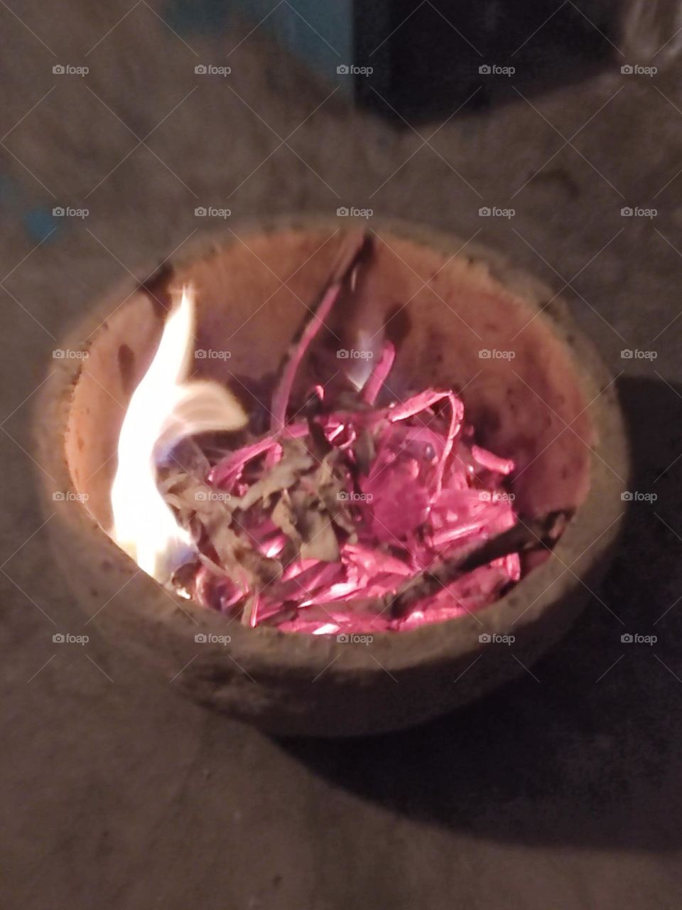 A fire was set inside an earthen pot to ward off the cold.