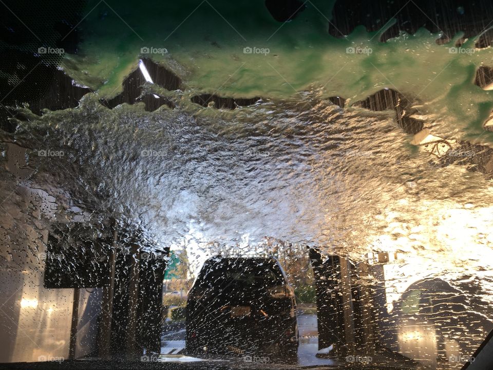 Water being blown away from a windshield in a car wash in Florida 