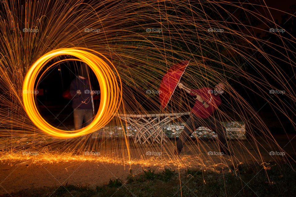 Burning steel wool spinning on the beach