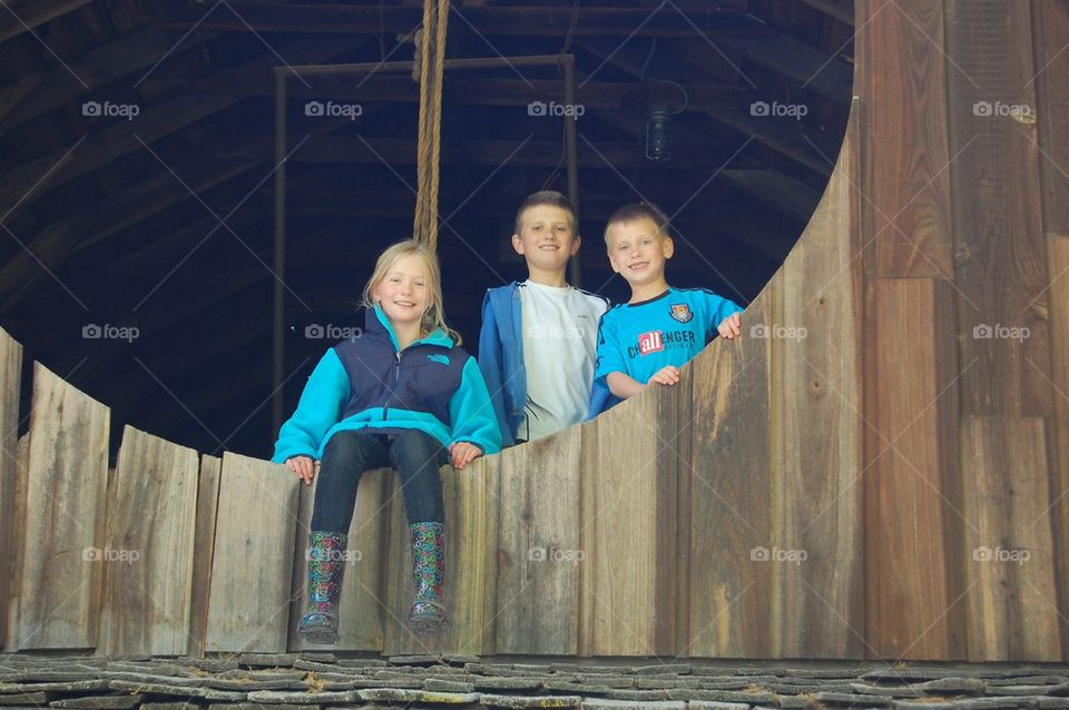 Barn window with kids